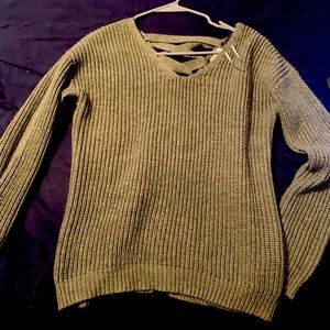 Super cute, thick winter sweater with cross back!